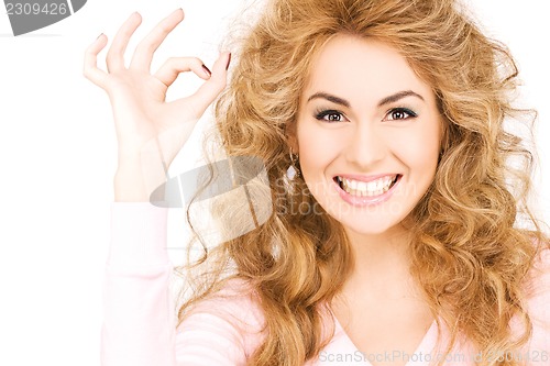 Image of lovely woman showing ok sign