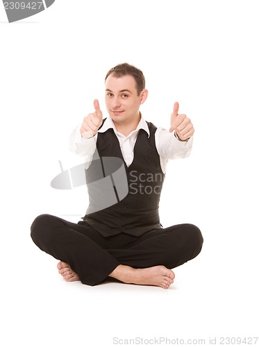 Image of businessman sitting in lotus pose