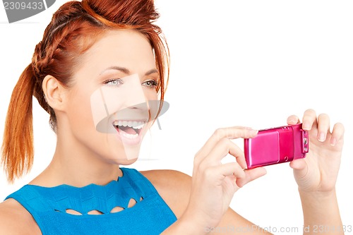 Image of happy woman using phone camera