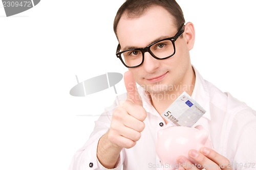 Image of businessman with piggy bank and money