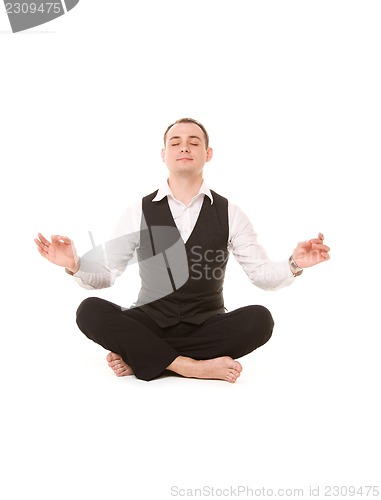 Image of businessman sitting in lotus pose