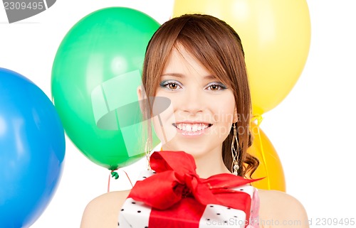 Image of party girl with balloons and gift box