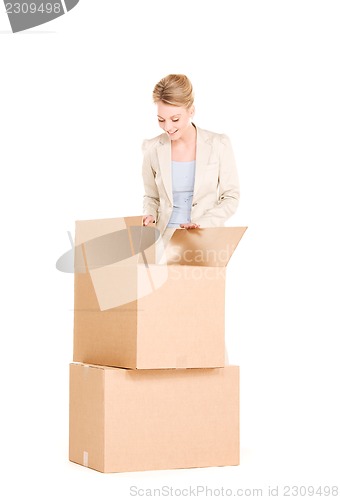 Image of businesswoman with boxes