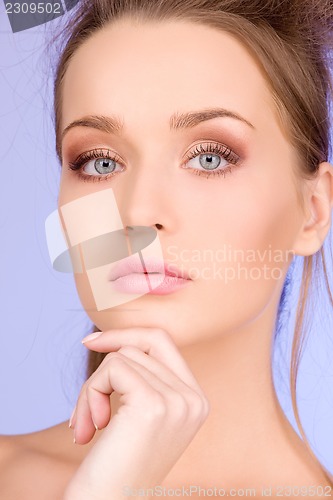 Image of lovely woman over blue