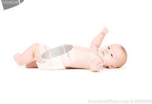 Image of laying baby boy in diaper