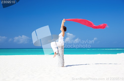 Image of happy woman on the beach