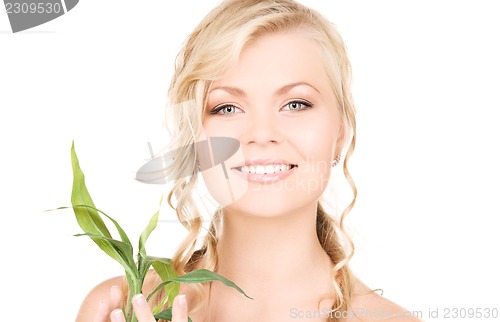 Image of woman with bamboo