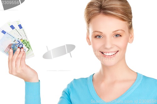 Image of lovely woman with money in hands