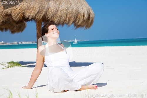 Image of happy woman on the beach