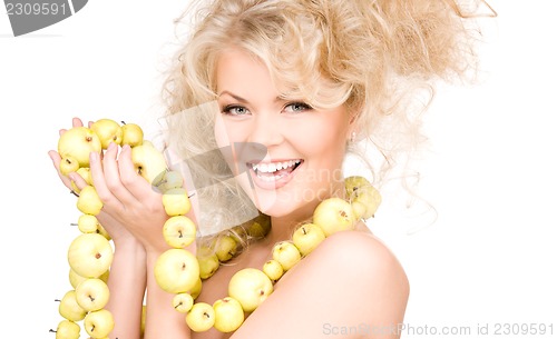 Image of happy woman with green apples