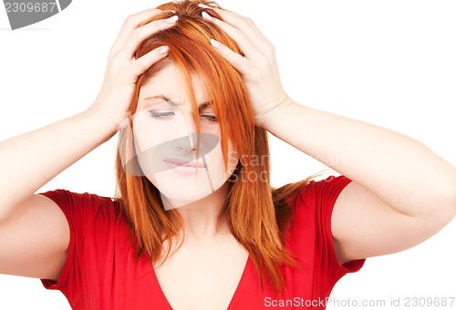 Image of unhappy redhead woman