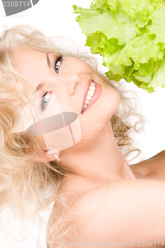 Image of happy woman with lettuce