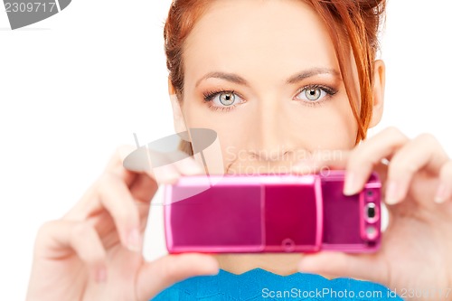 Image of happy woman using phone camera