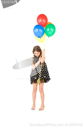 Image of happy girl with colorful balloons