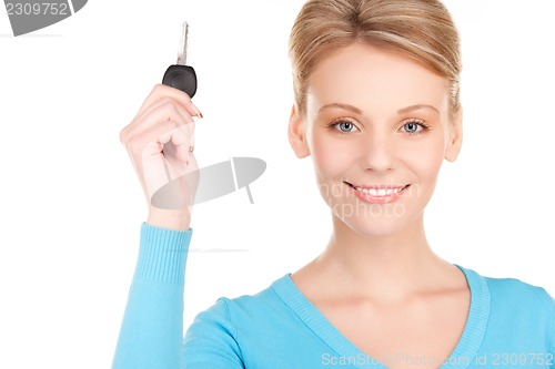 Image of happy woman with car key