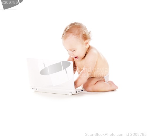 Image of baby boy with laptop computer