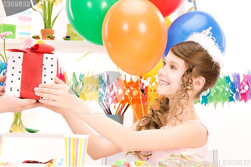 Image of party girl with balloons and gift box