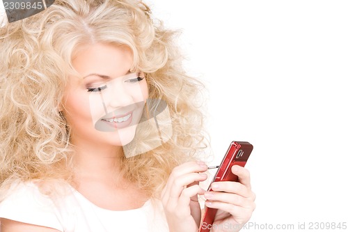 Image of happy woman with cell phone