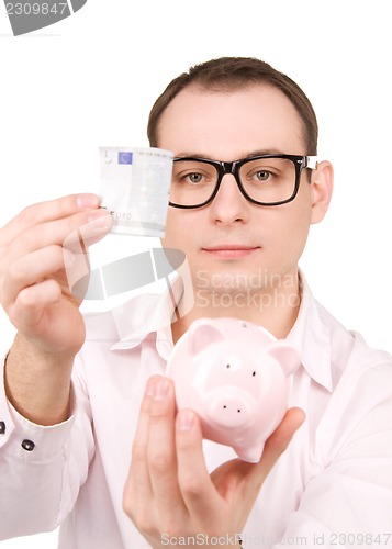 Image of businessman with piggy bank and money