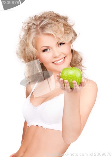 Image of young beautiful woman with green apple