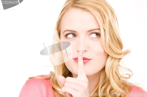 Image of finger on lips