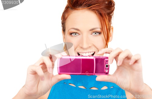 Image of happy woman using phone camera