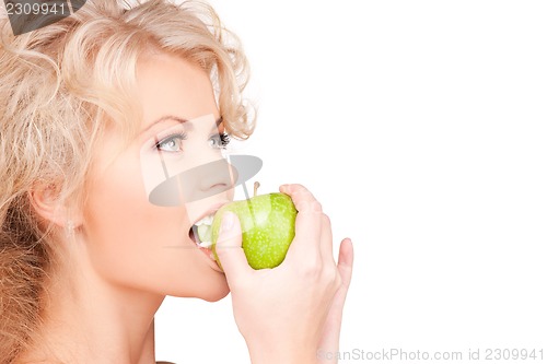Image of young beautiful woman with green apple