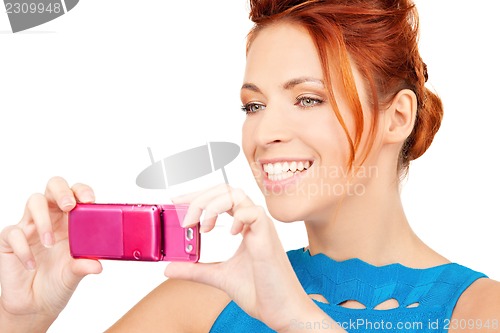 Image of happy woman using phone camera