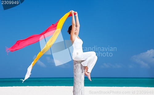 Image of happy woman on the beach