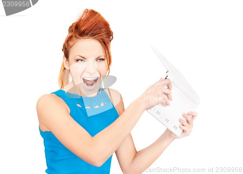 Image of angry woman with laptop computer