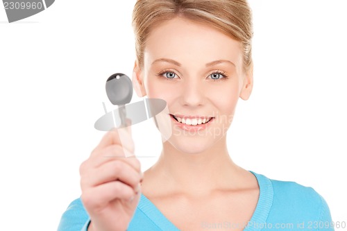 Image of happy woman with car key