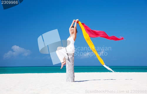 Image of happy woman on the beach