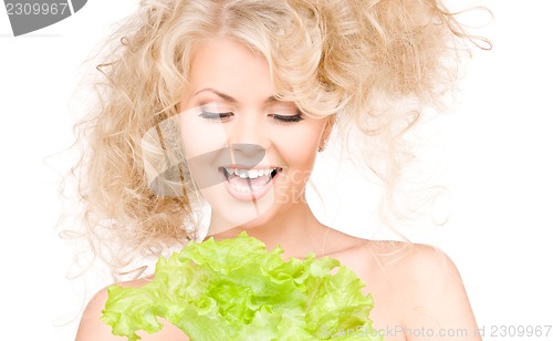Image of happy woman with lettuce
