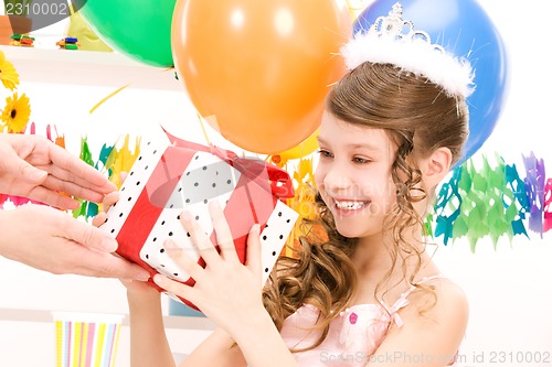 Image of party girl with balloons and gift box