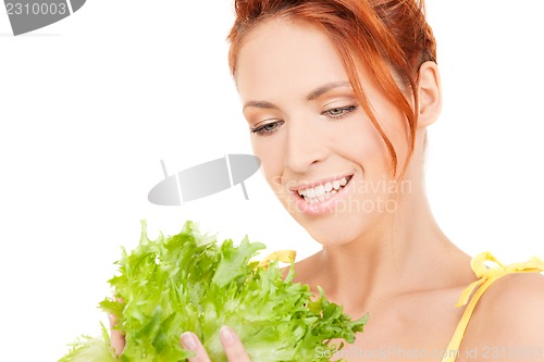 Image of happy woman with lettuce