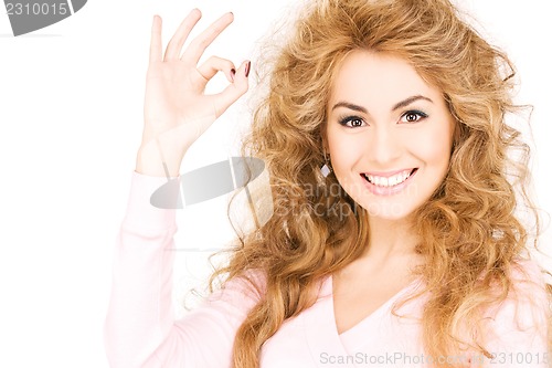 Image of lovely woman showing ok sign