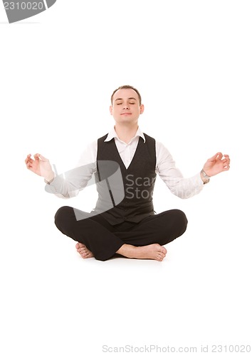 Image of businessman sitting in lotus pose