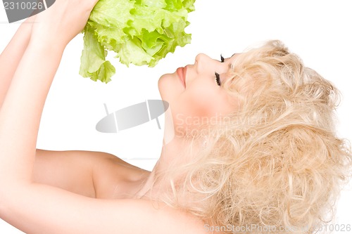 Image of happy woman with lettuce