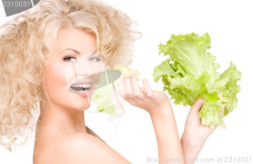 Image of happy woman with lettuce