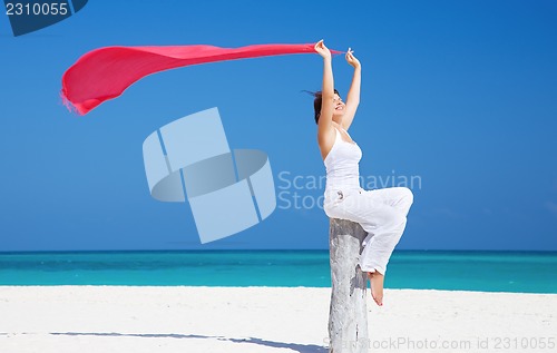 Image of happy woman on the beach