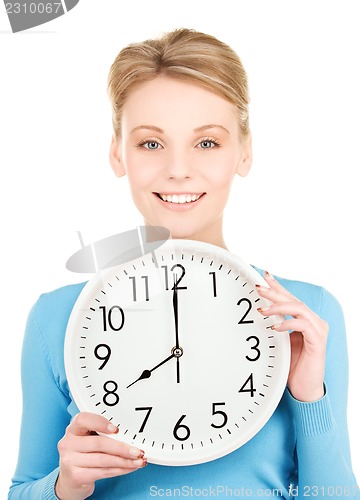 Image of woman holding big clock