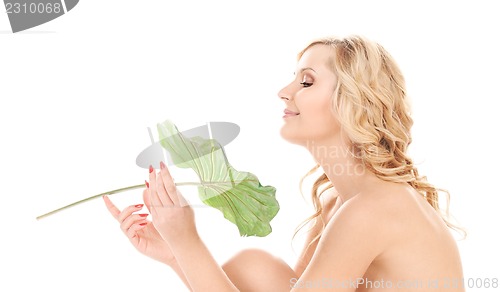 Image of woman with green leaf