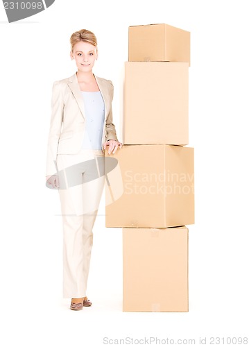 Image of businesswoman with boxes