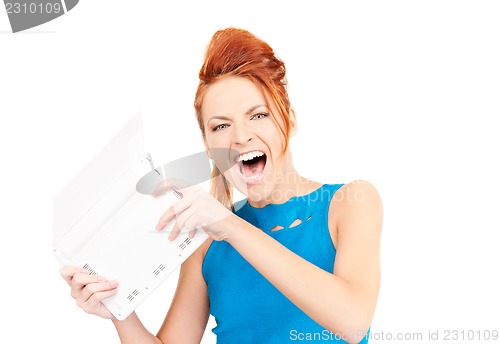 Image of angry woman with laptop computer