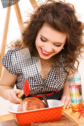 Image of young attractive woman in the kitchen