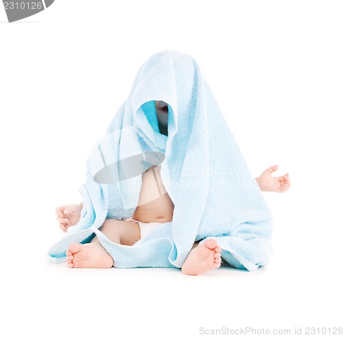 Image of baby with blue towel