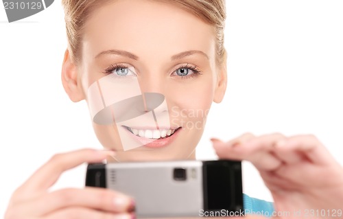 Image of happy woman using phone camera