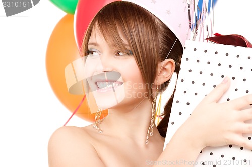 Image of party girl with balloons and gift box