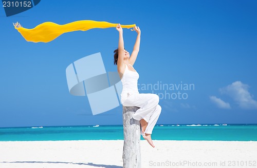 Image of happy woman on the beach