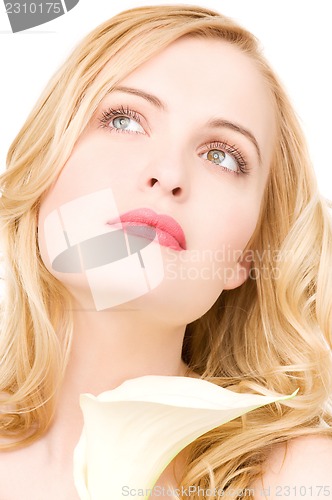 Image of beautiful woman with white flower